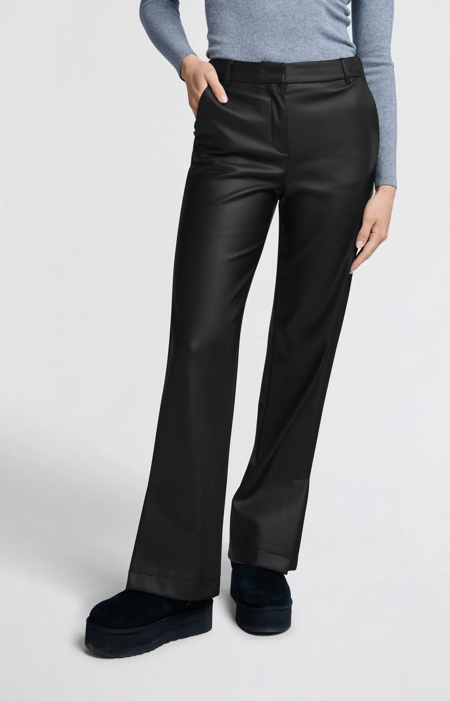 Black faux leather trousers with wide legs